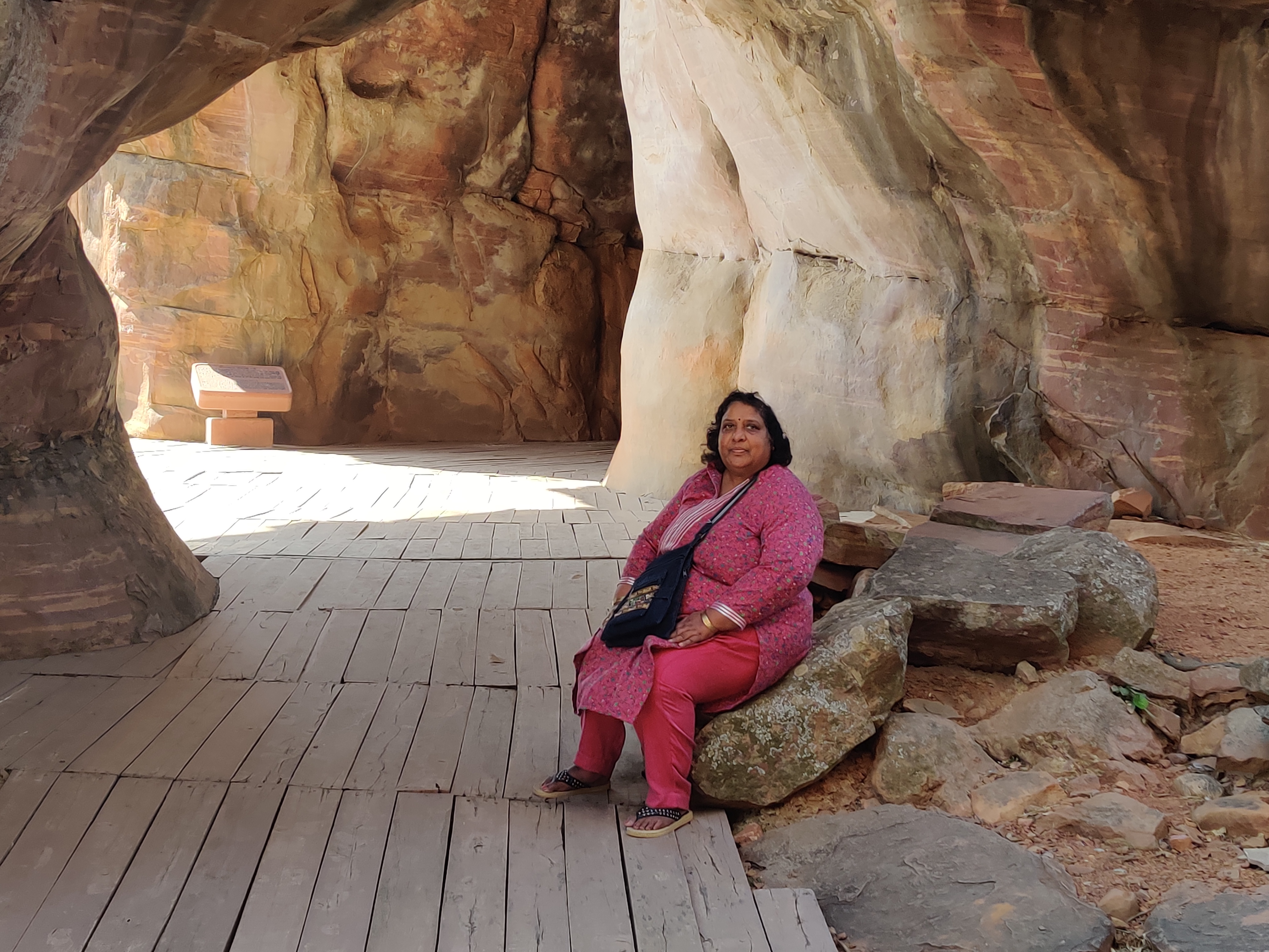 Image of author sitting at the enterance of first cave.